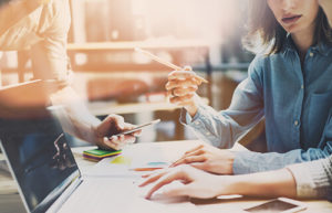 SEO professionals collaborating on a content audit