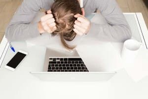 a frustrated man is realizing the truth of Internet Marketing Myth #5