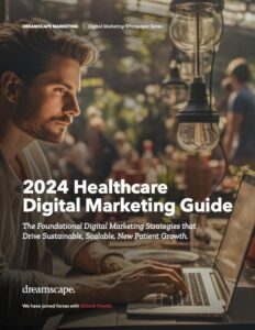 Cover image 2024 Healthcare Digital Marketing Guide. Healthcare marketer working on laptop creating digital strategies.